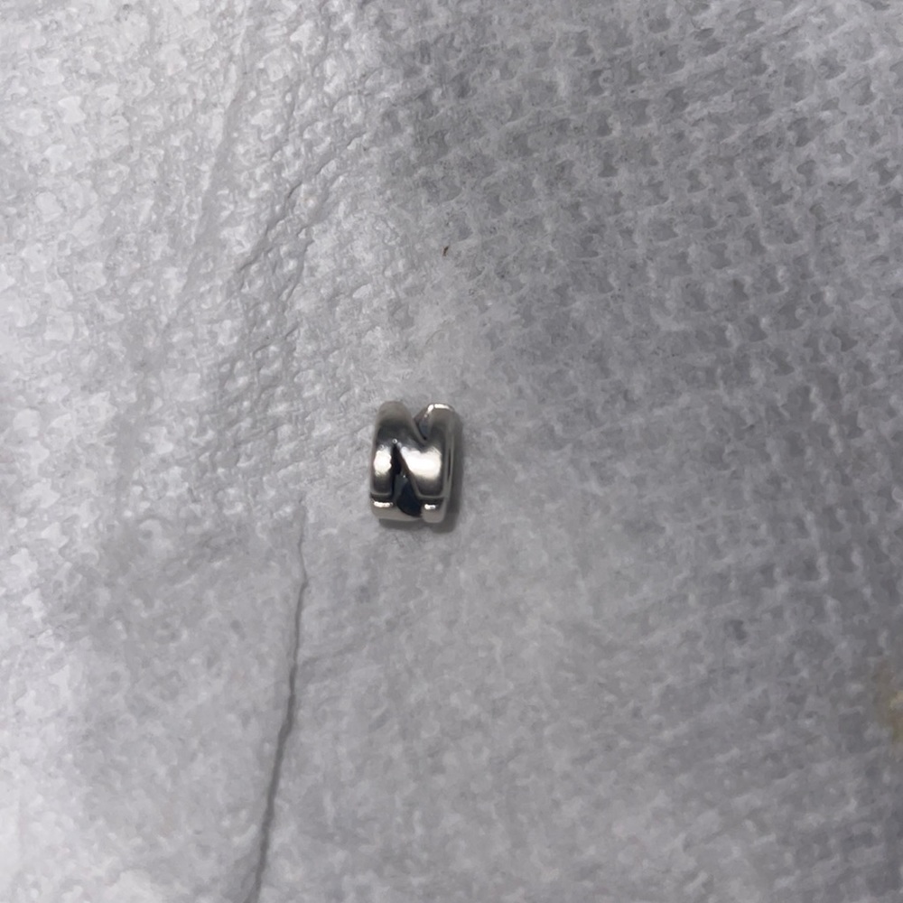 925 the leather and charm sterling silver fits Pandora, but is a Camilla charm